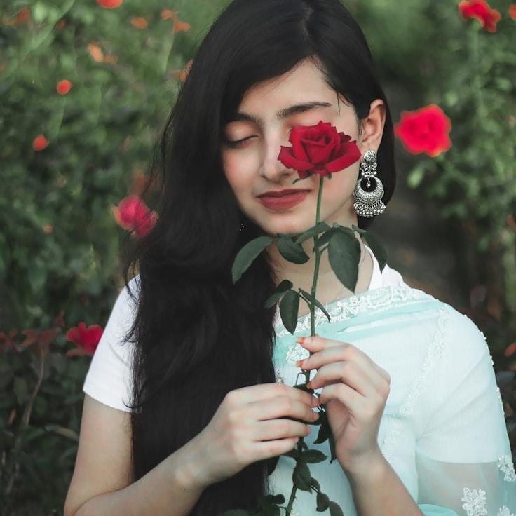 Alex Carter, Lead Design Curator at WarmLedgerNote, reviewing corporate floral arrangements